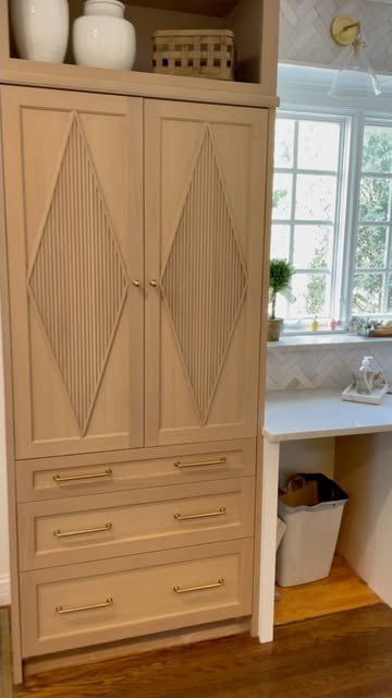 Custom light-wood cabinet with diamond-pattern doors.
