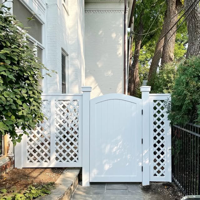 Painted wood gate and lattice on a house David worked.